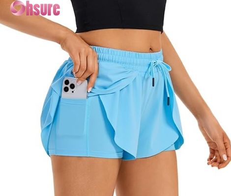 Shorts de gymnastique pour femmes à jupe flottante en 2 en 1 Shorts de course enveloppés avec poche taille haute Vêtements de sport pour l'entraînement de yoga