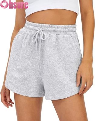 Shorts de sport taille haute pour femmes à séchage rapide, jupes-shorts respirantes avec poches pour la course et l'exercice, décoration à motifs à la mode