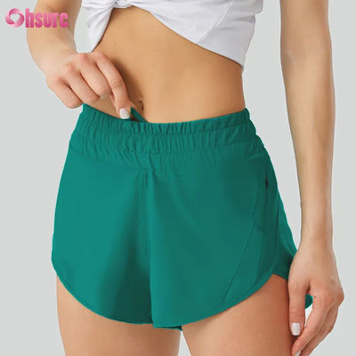Shorts de yoga décontractés pour femmes hautement respirants Pantalon d'entraînement en polyester sec rapide avec poches de taille élastiques pour le sport et la course