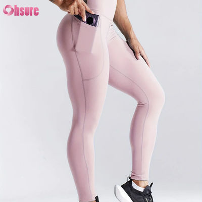 Leggings de yoga taille haute à séchage rapide pour le fitness sportif, avec effet push-up et poches latérales pour femmes