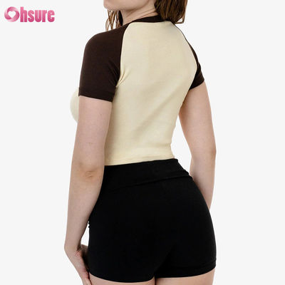 T-shirt de sport 100% coton pour femmes, manches tricotées et étirées, haut décontracté respirant avec option de logo personnalisé.