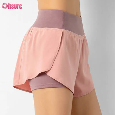 Vente à chaud Shorts de course de taille haute pour femmes Rapide sec Double couche Pantalon d'entraînement athlétique Poches respirantes Fitness Yoga porter