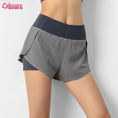 Vente à chaud Shorts de course de taille haute pour femmes Rapide sec Double couche Pantalon d'entraînement athlétique Poches respirantes Fitness Yoga porter