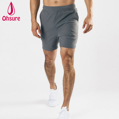 Shorts de sport pour hommes, entraînement en salle de sport, poches avant profondes, extensible dans les quatre sens, matériau léger, design de logo personnalisé par le fabricant d'équipement d'origine