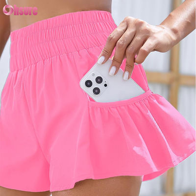 Shorts de course de sport à haute taille Gymnase séchée rapide avec poches de couleur solide Shorts à séchage rapide