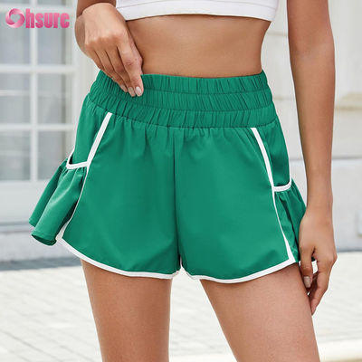 Shorts de course de sport à haute taille Gymnase séchée rapide avec poches de couleur solide Shorts à séchage rapide